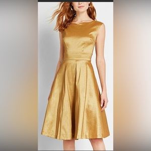 Gold party dress. Fit and flare with tulle underskirt. Slight stretch. Cute!
